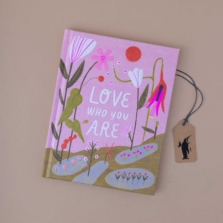 book-cover-of-love-who-you-are-showing-flowers-on-a-pink-background