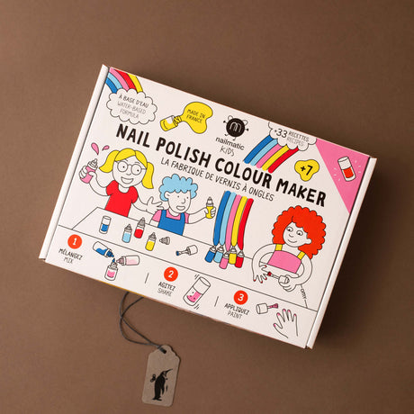 nail-polish-kit-in-white-box-with-illustrated-children-and-rainbow