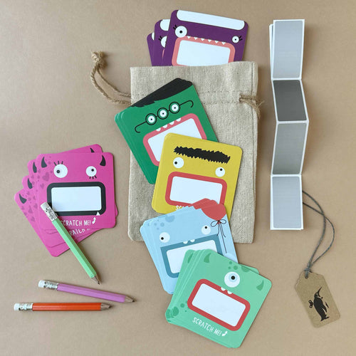 assorted-monster-themed-cards-with-silver-scratch-off-stickers-and-pencils
