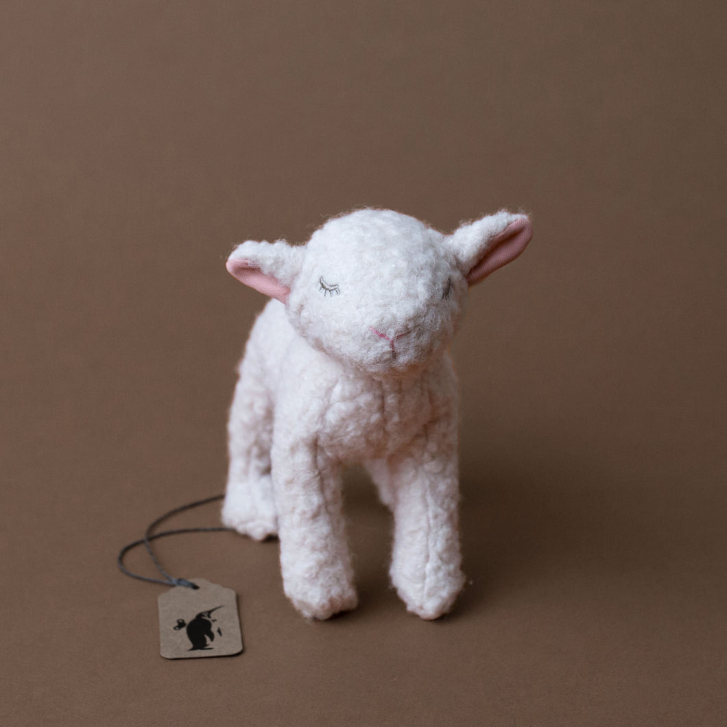 mary-the-lamb-stuffed-animal-standing-with-stitched-sleeping-eyes
