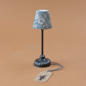 black-lamp-stand-with-blue-floral-shade