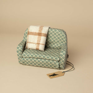 mint-floral-matchbox-mouse-couch-with-tan-plaid-blanket