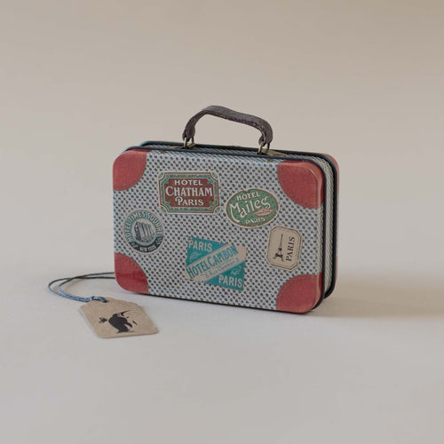 light-grey-matchbox-mouse-suitcase-with-travel-stickets-and-red-accents