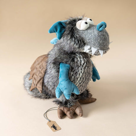 dragon-stuffed-animal-with-teal-arms-and-spines-and-brown-claws-and-wings