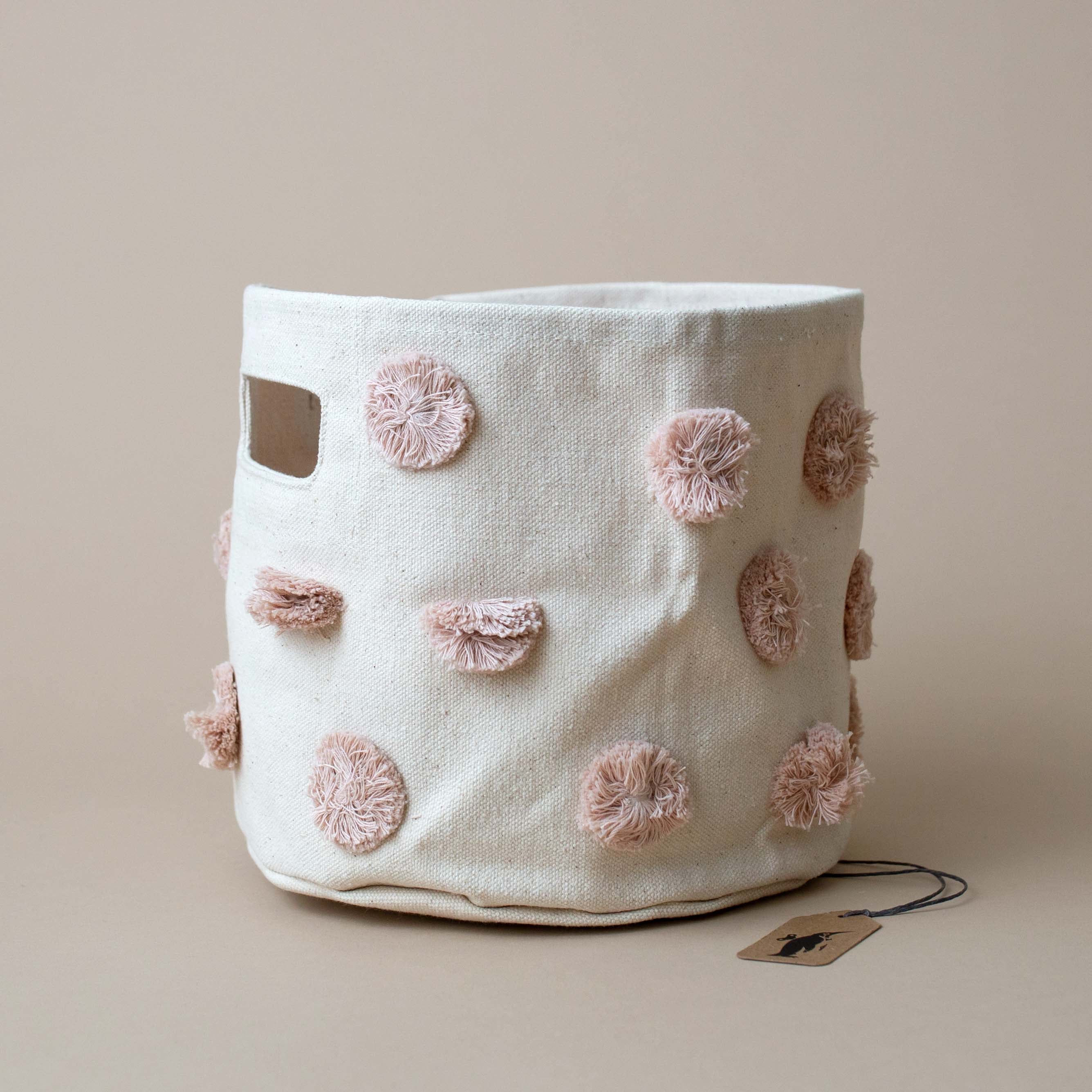 rose-pom-poms-on-natural-canvas-bin