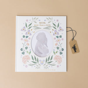 mom-more-than-a-little-book-cover-with-floral-vines-outlining-mom-and-child-hugging