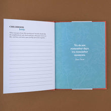 Load image into Gallery viewer, open-book-with-a-white-fill-in-page-and-a-blue-page-with-floral-pattern-and-a-quote