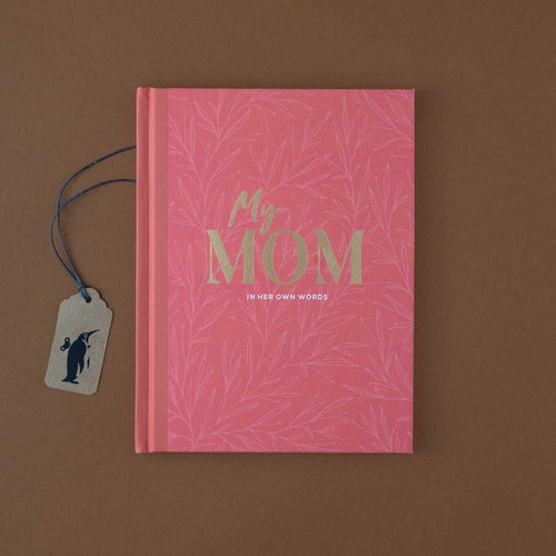 pink-book-cover-with-golden-letters-and-floral-pattern
