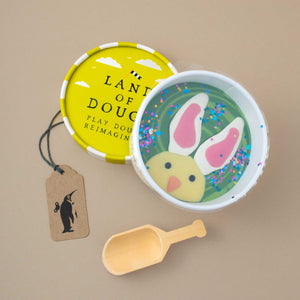 container-of-natural-play-dough-with-image-of-chick-with-bunny-ears-and-wooden-scoop