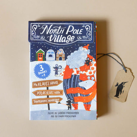 north-pole-village-Board-Book-Set-blue-snowy-home-scene-with-santa-on-cover