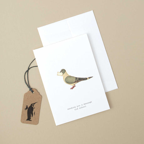 white-greeting-card-illustrated-pigeon-holding-letter-and-black-text-reading-sending-you-a-message-old-school