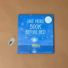 Load image into Gallery viewer, one-more-book-before-bed-book-blue-cover--with-a-parent-and-child-reading-a-book-in-bed-surrounded-by-stars-and-calm-sea