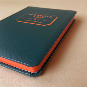 one-sketch-a-day-journal-with-blue-hardcover-and-orange-printed-title