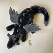 Load image into Gallery viewer, black-onyx-dragon-stuffed-animal-with-sparkle-wings-and-spines-in-laying-position-top-view