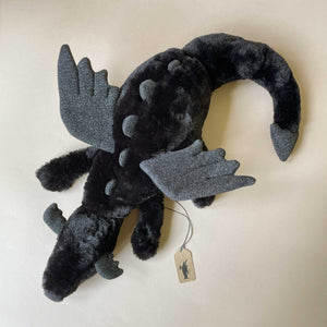 black-onyx-dragon-stuffed-animal-with-sparkle-wings-and-spines-in-laying-position-top-view