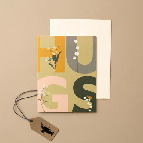 green-card-large-word-hugs-with-flowers-growing-out-of-the-letters
