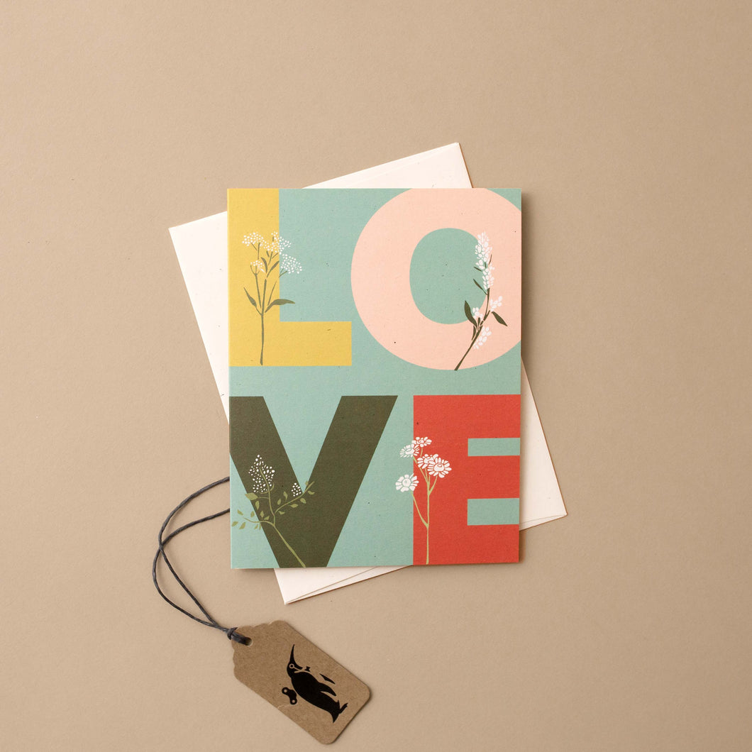 blue-card-l-o-v-e-letters-with-flowers-growing-from-them