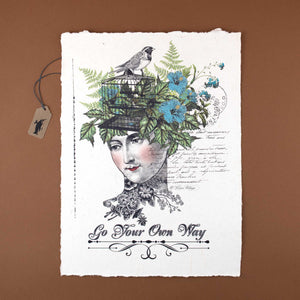 handmade-paper-with-illustration-on-female-head-with-flowers-as-her-hair-and-a-bird-cage