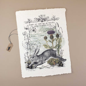 white-handmade-paper-with-jumping-rabbit-lilac-thistle-stamps-and-text