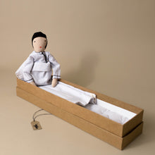Load image into Gallery viewer, cloth-doll-in-blue-checked-pajamas-in-long-box-bed