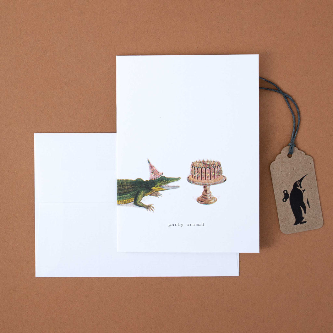 white-greeting-card-illustrated-alligator-with-cake-and-black-text-reading-party-animal