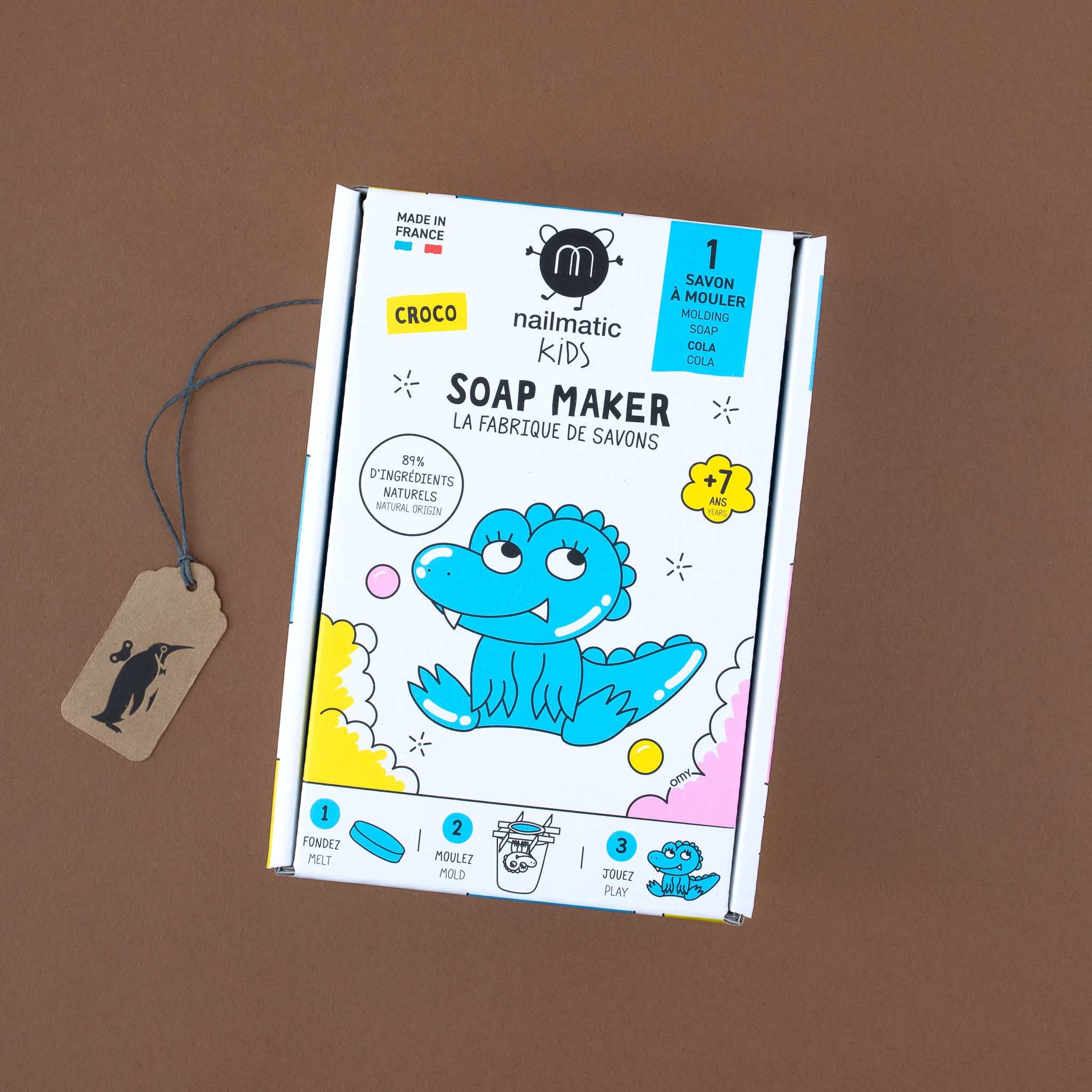 white-cardboard-box-with-blue-illustrated-crocodile