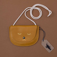 Load image into Gallery viewer, ochre-pouch-with-white-strap-and-gold-cat-face
