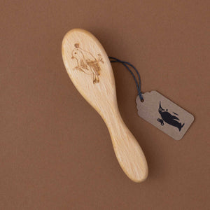 small-wooden-brush-with-bird-engraved