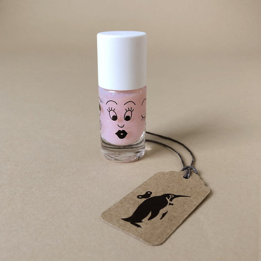 light-pink-sparkle-nail-polish-in-bottle-with-surprised-face