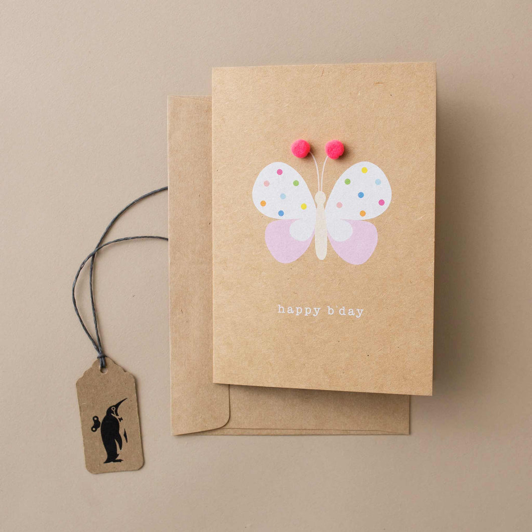 greeting-card-with-butterfly-and-pom-accents-on-natural-background-and-the-words-happy-b'day