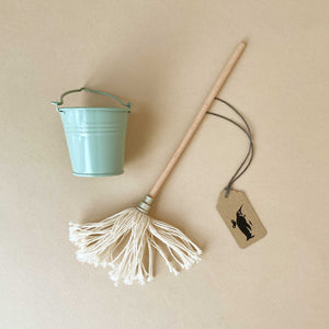wooden-mop-and-min-metal-bucket-laid-out-together