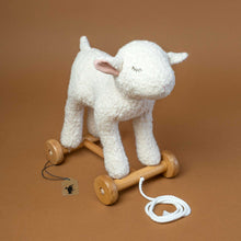 Load image into Gallery viewer, stuffed-mary-lamb-on-wooden-wheels-to-pull-along-with-stitched-sleeping-face