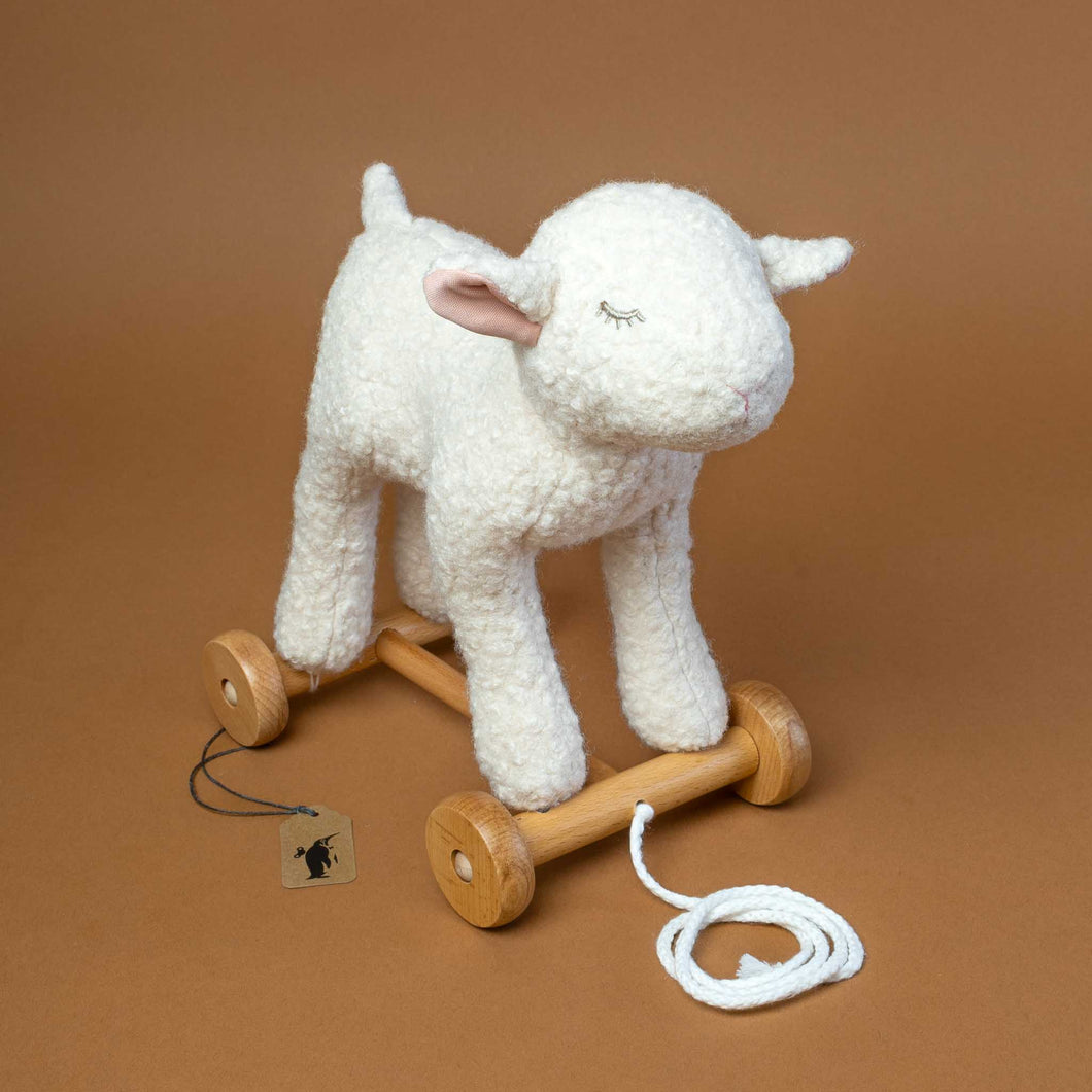 stuffed-mary-lamb-on-wooden-wheels-to-pull-along-with-stitched-sleeping-face