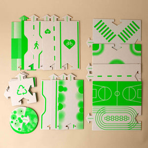 downtown-road-system-pieces-green-ink-on-recycled-cardboard-background