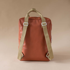 back-view-red-backpack-wtih-khaki-straps