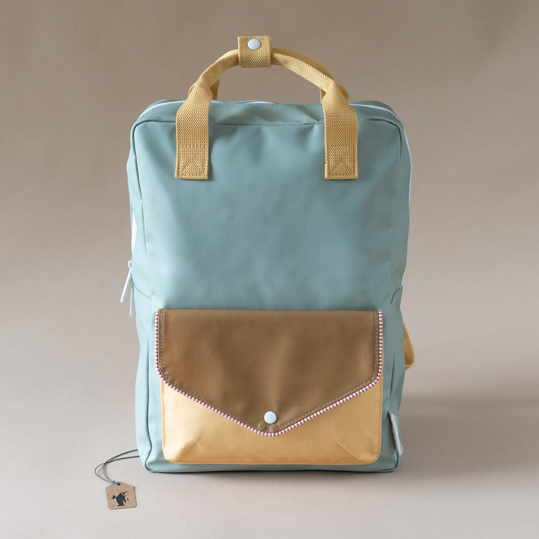 green-backpack-with-yellow-and-khaki-envelope-poocket-and-yellow-straps