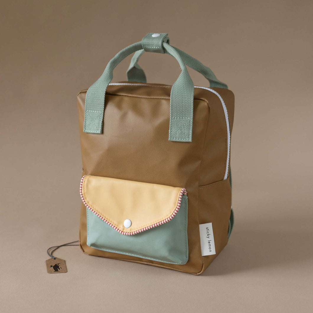 khaki-green-backpack-with-green-and-yellow-envelope-pocket-and-green-straps