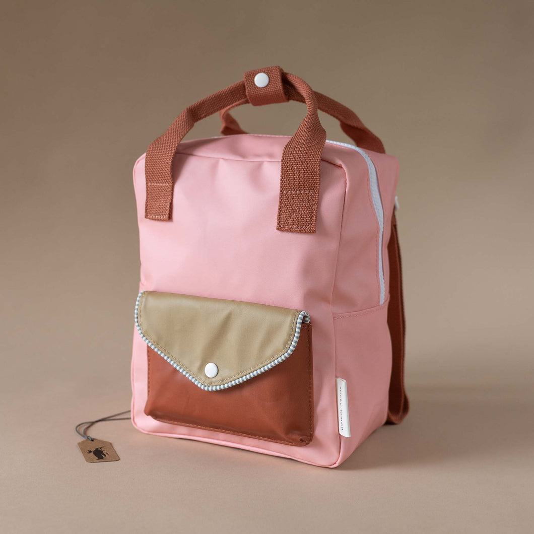 blush-backpack-with-red-and-khaki-envelope-pocket-and-red-straps