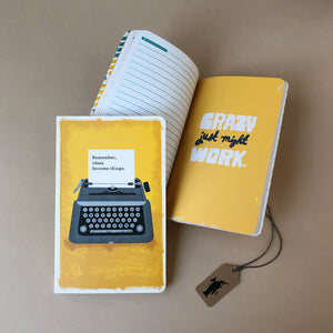 Front-cover-and-inside-page-of-Remember-Ideas-Become-Things-softback-journal-yellow-background-with-grey-typewriter