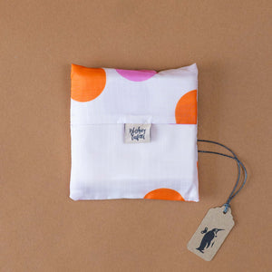 white-with-orange-and-pink-polka-dots-folded-in-pouch