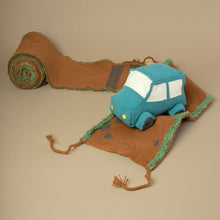 Load image into Gallery viewer, blue-stuffed-jeep-car-on-fabric-roll-that-looks-like-a-safari-road
