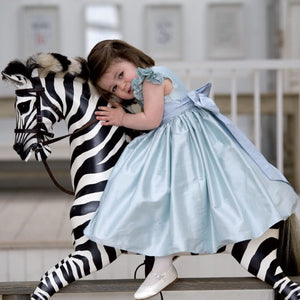handmade-wooden-rocking-zebra-with-little-girl-riding