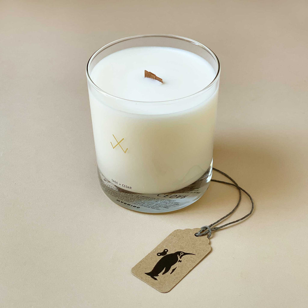 white-wax-candle-with-wooden-wick-in-clear-glass-candle-holder