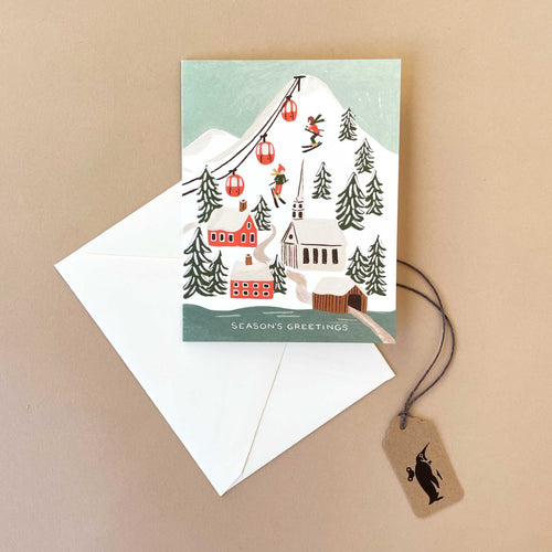seasons-greetings-gift-card-showing-winter-skiing-scene