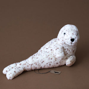 white-seal-stuffed-animal-with-brown-spots