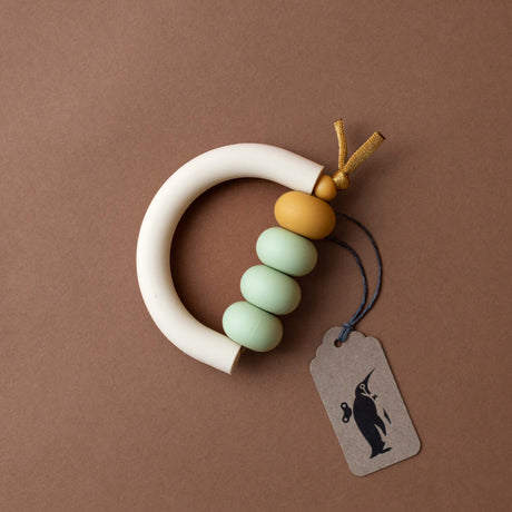 cream-silicone-arch-with-sage-and-ochre-silicone-beads