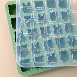 green-silicone-tray-with-cat-bear-and-rabbit-shaped-molds-shown-with-clear-lid
