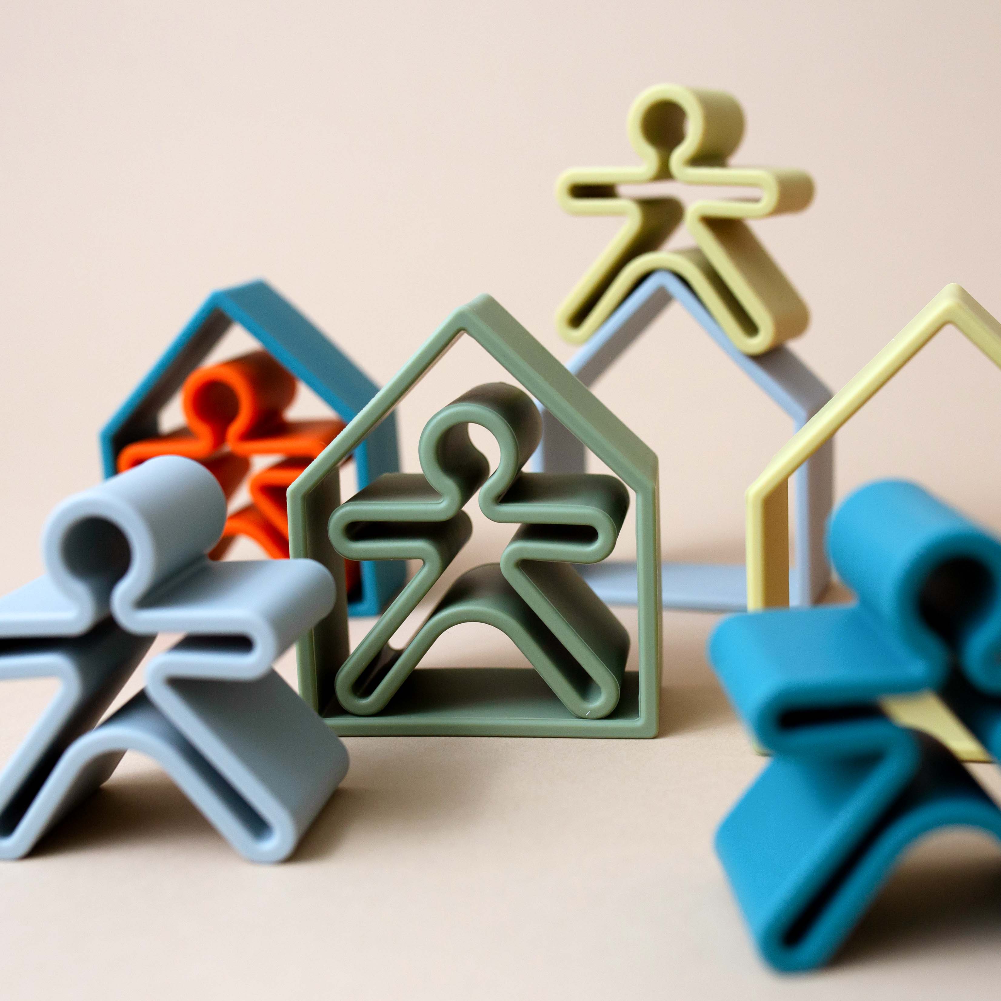 balancing-and-individual-silicone-people-figures-inside-matching-house-outlines