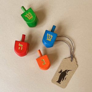 small-dreidel-in-red-green-blue-or-orange-with-gold-hewbrew-letters
