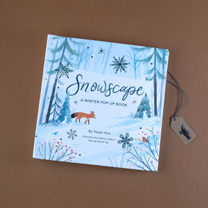snowscape-a-winter-pop-up-book-showing-a-fox-walking-through-a-wintery-forest